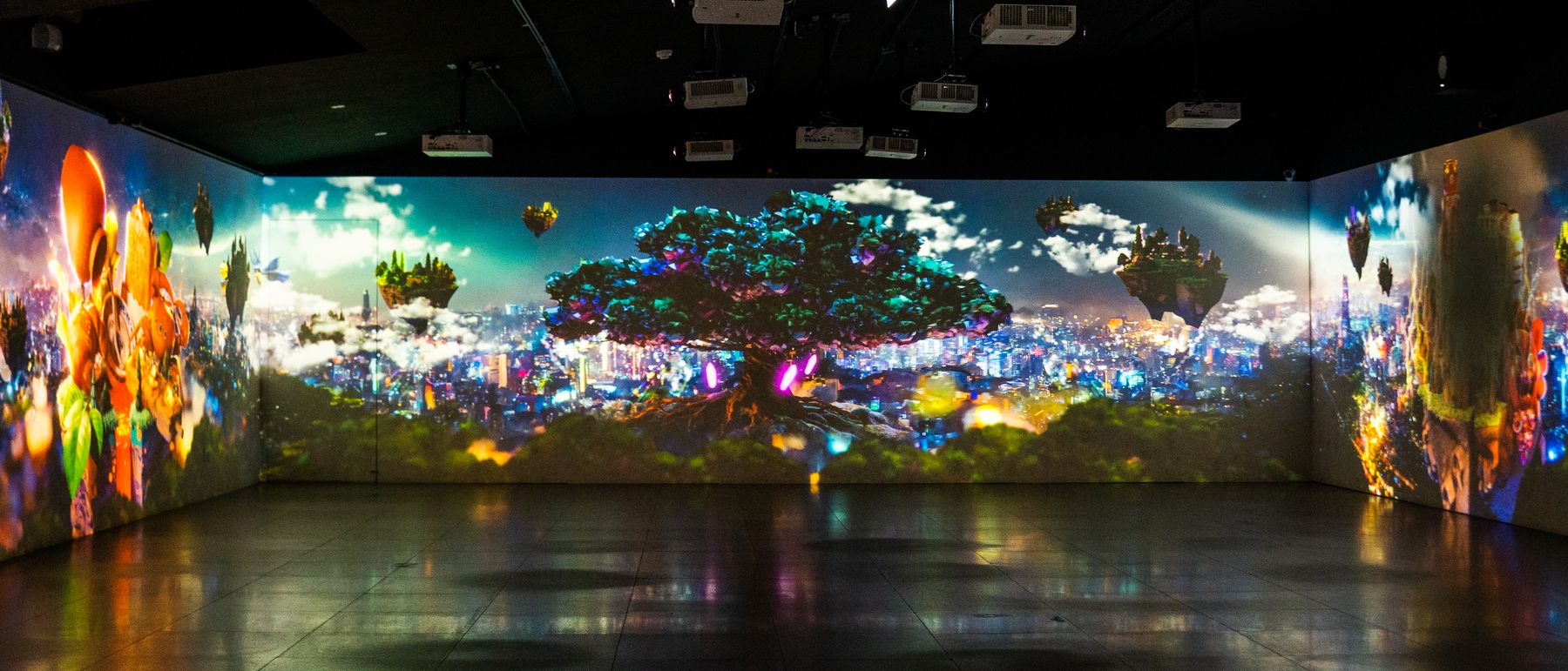 A child watches their drawn creature take flight across a projected wall.